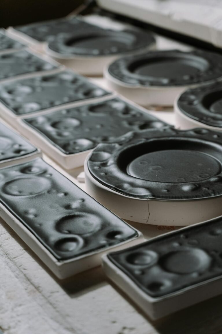 Detailed image of black plastic injection molds used in manufacturing industry.