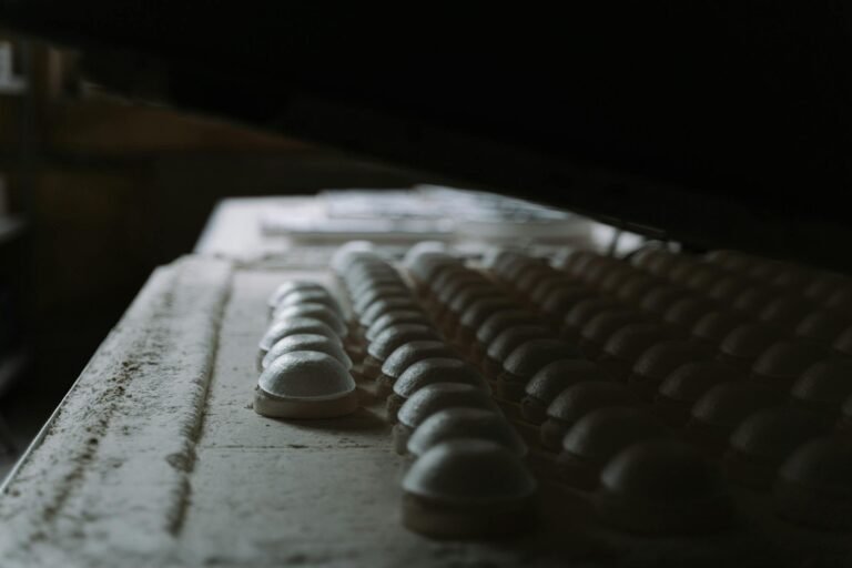 Rows of molded domes in a factory setting, showcasing industrial manufacturing processes.